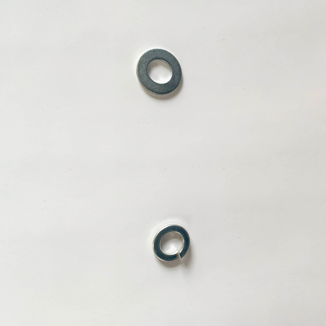 The assembly utilized standard M12 flat washers fabricated from aluminum 1060
